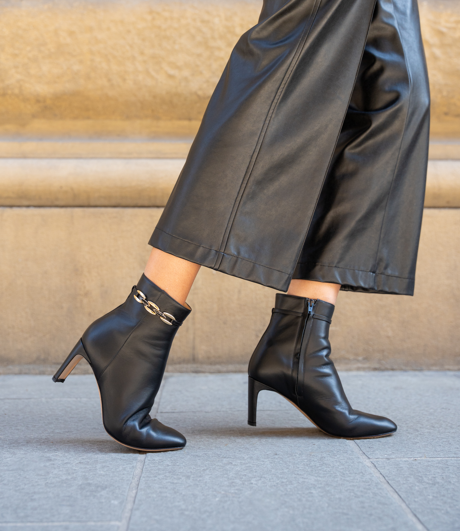 Woman wearing black booties